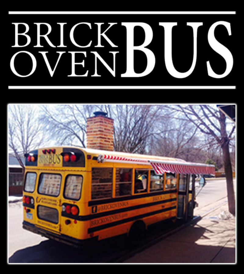 The Brick Oven Bus — a wood-fire pizza food truck built from a short school bus with a tall brick chimney